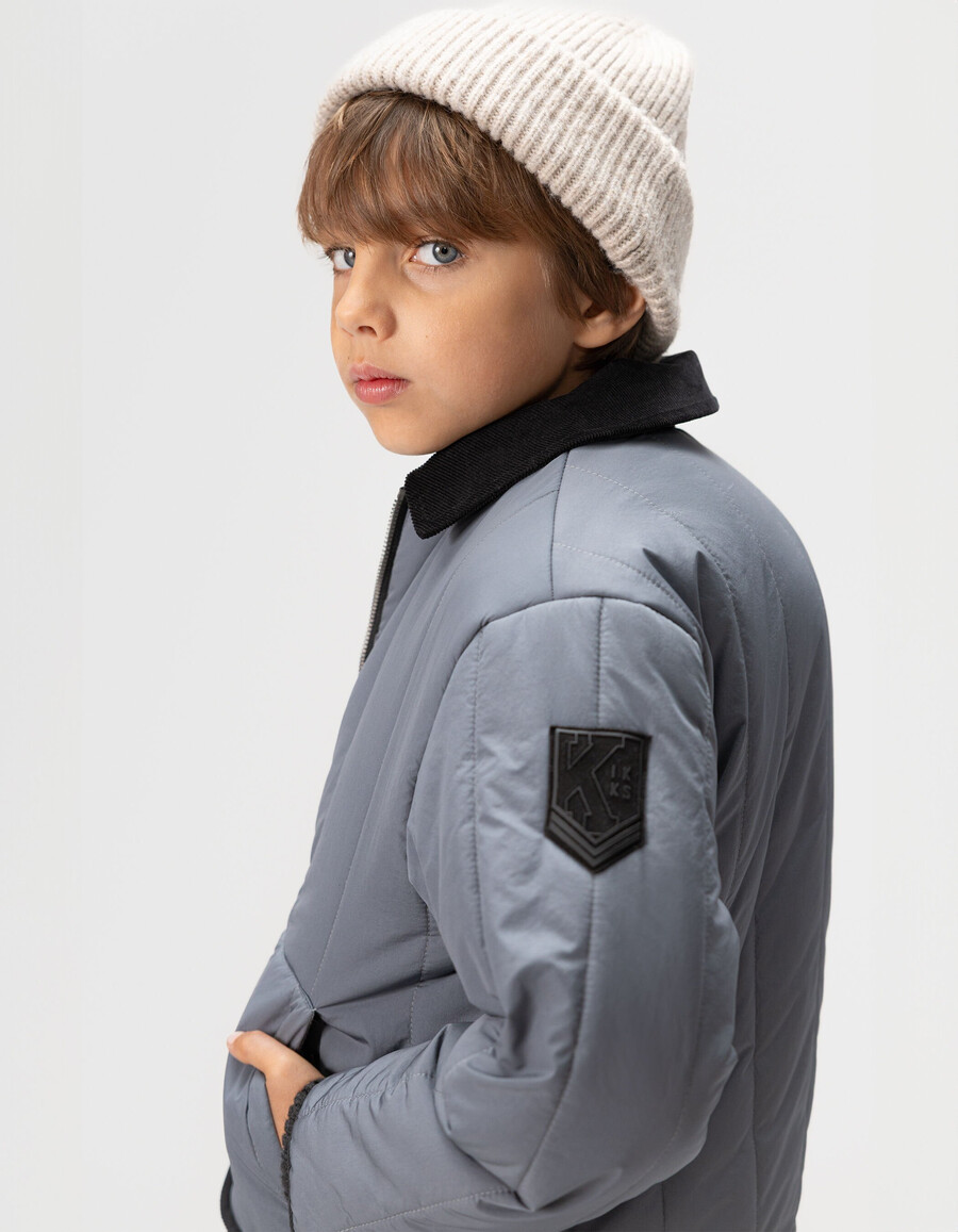 blaue steppjacke für jungen mit samtkragen
