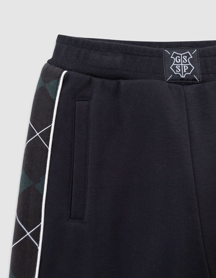 grüne harry-potter-hose für jungen mit karierten seiten
