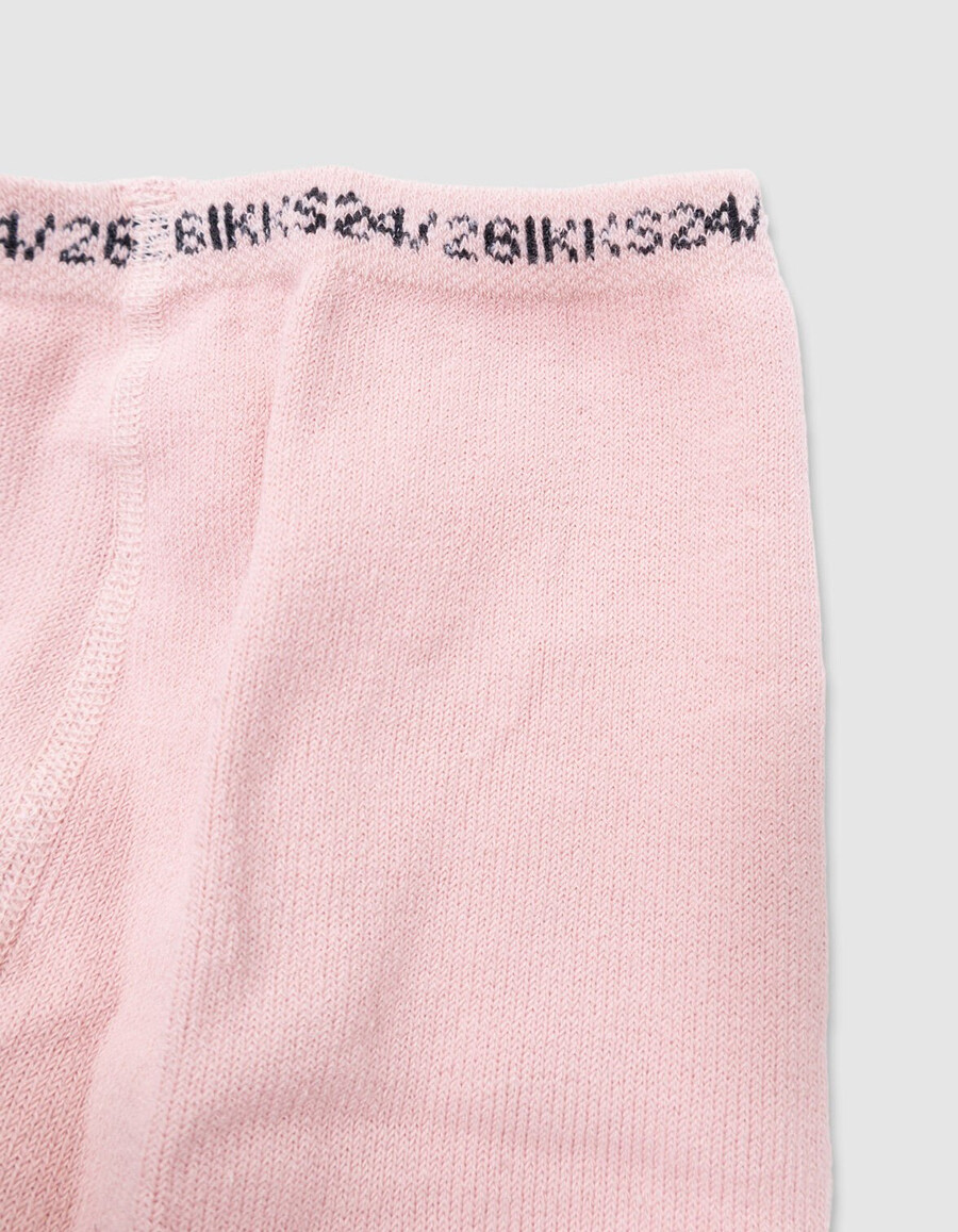 mädchen-strumpfhose aus rosa jacquard-strick mit schleife