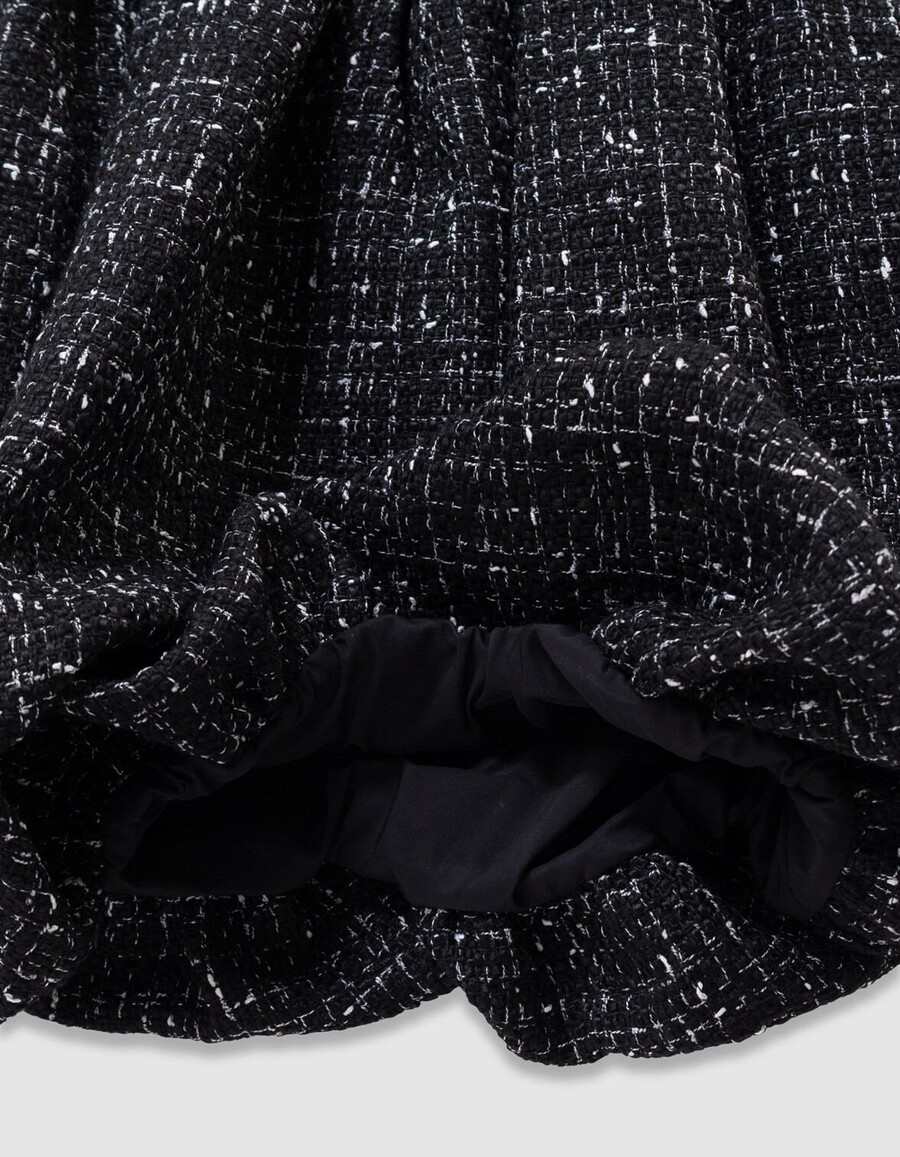 schwarzes mädchenkleid aus tweed-optik und verschiedenen stoffen