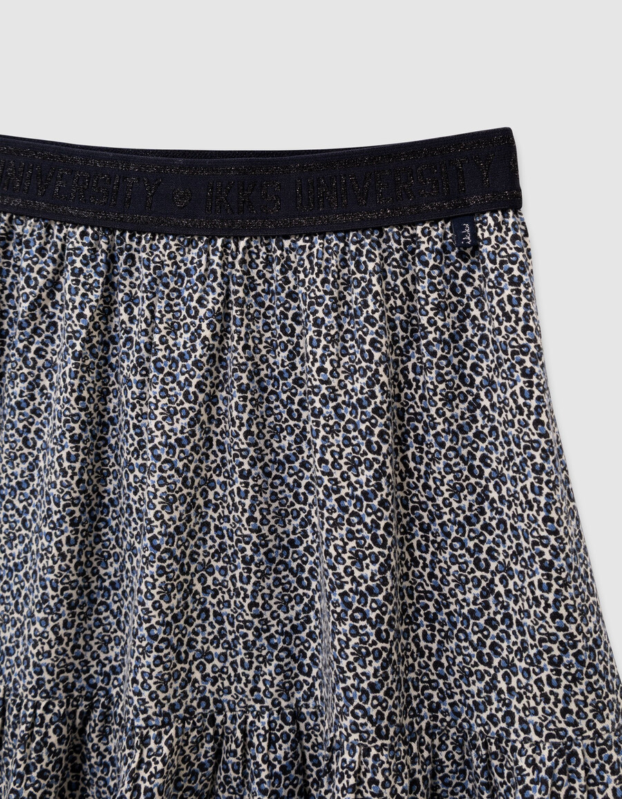 kurzer mädchenrock in marineblau mit leoparden-schleifenmuster