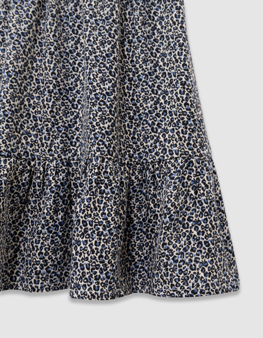 kurzer mädchenrock in marineblau mit leoparden-schleifenmuster