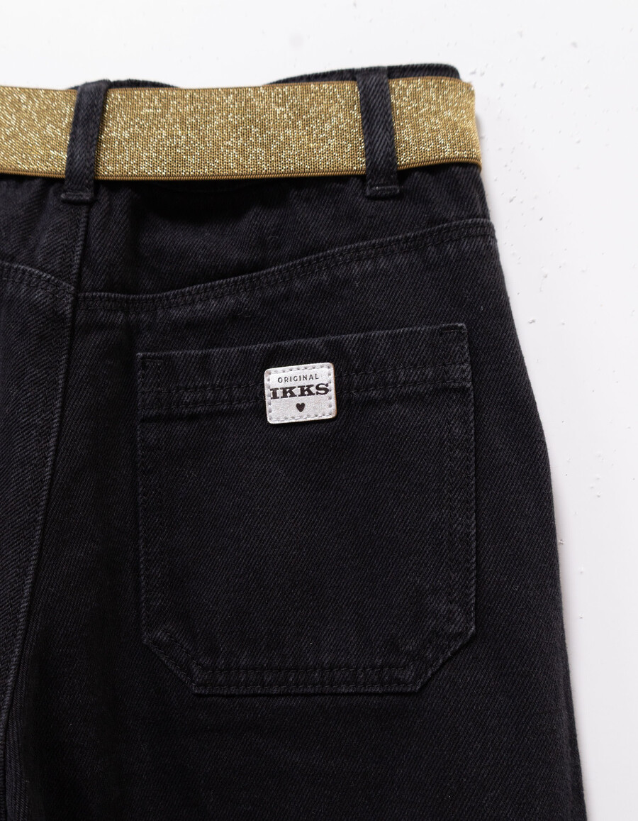 schwarze mädchenjeans mit weitem bein falten und schleifen