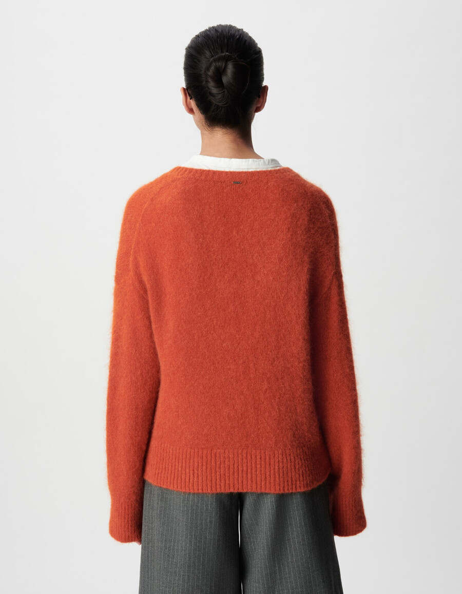 orangefarbener oversize-pullover mit v-ausschnitt für damen