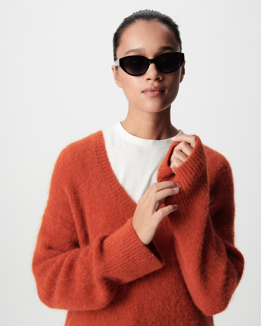 orangefarbener oversize-pullover mit v-ausschnitt für damen