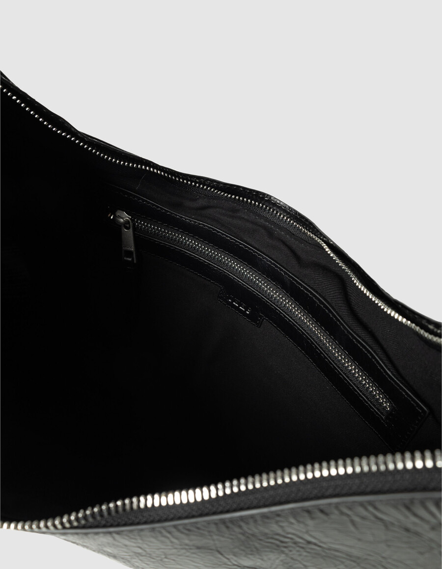 schwarze allane-halbmondtasche aus glasiertem leder für damen