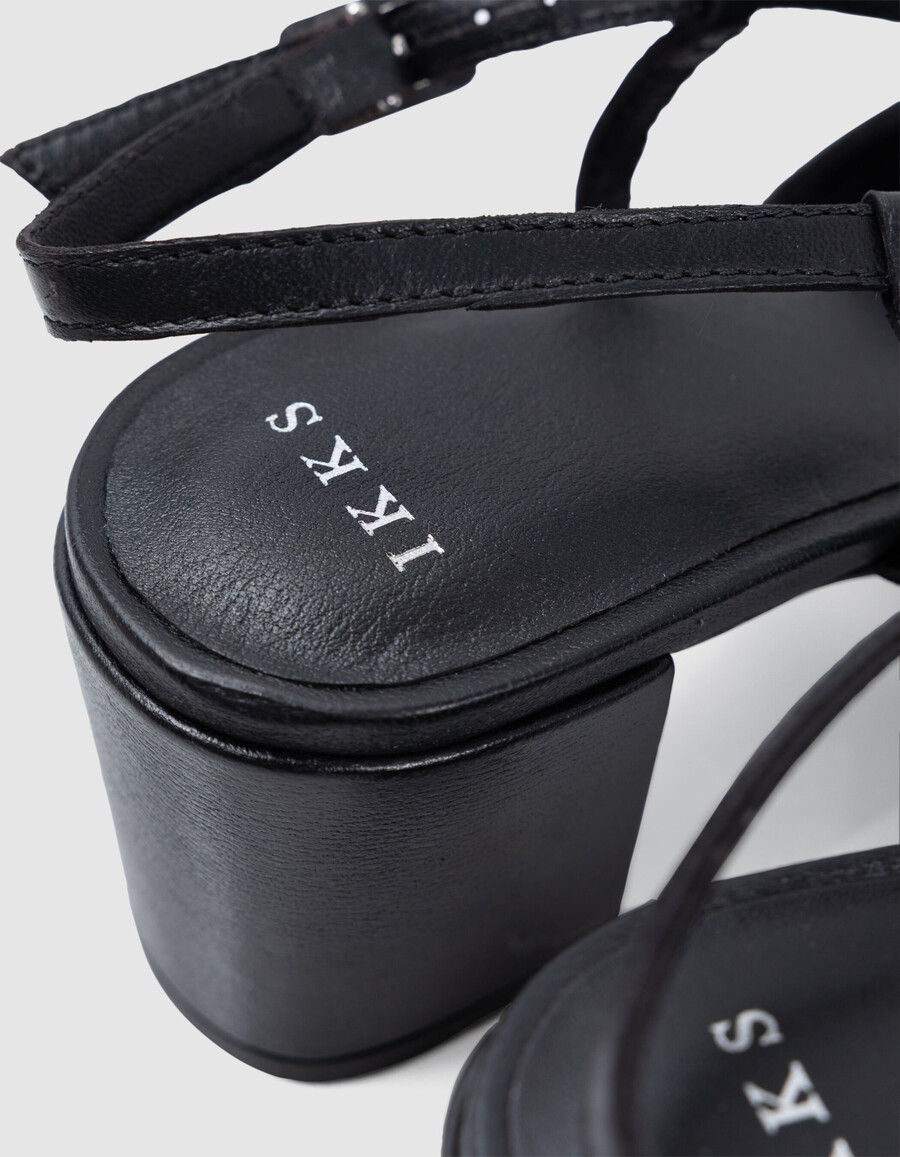 schwarze damen-slingback-pumps aus leder mit ösen