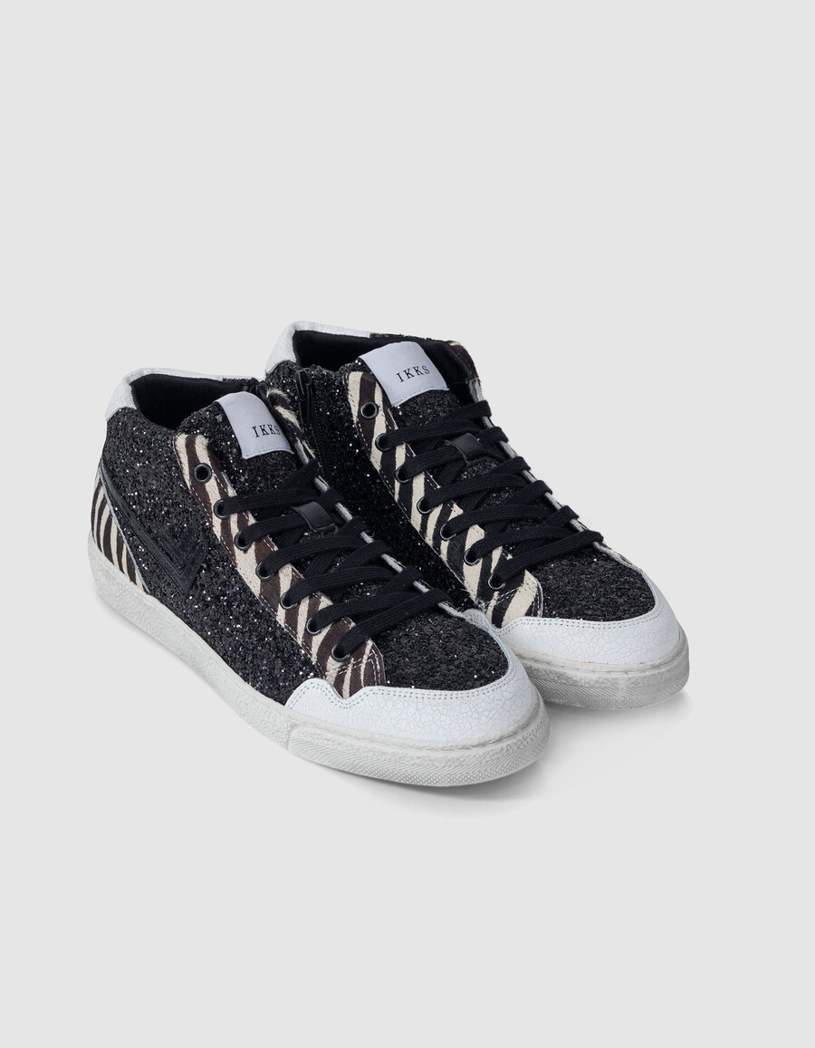 schwarze damen-sneaker mit mikro-pailletten und zebra-leder